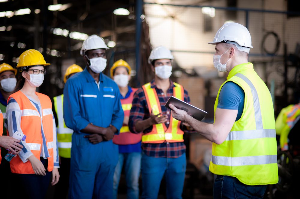 The manager leader team is assignmenting job, training for technicians, supervisor, engineers In the morning meeting before work which everyone wear masks to prevent the coronavirus and safety working